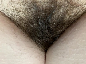 Intimate 4K footage of my dense, hairy nether region and prominent clitoris