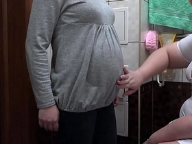 A pregnant woman receives a homemade enema from her nurse, leading to intense stimulation and orgasm