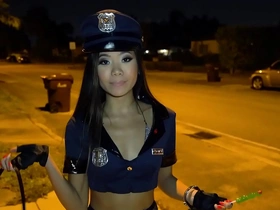 Young Asian teen Vina Sky gets dressed as a police officer for Halloween and engages in sexual activities with an officer
