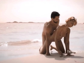 Provocative beach photo shoot escalates into steamy sexual encounter