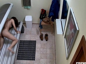 Hidden camera captures solo play of teenage girl in solarium