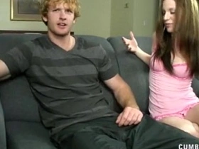 A hot brunette gets covered in fake cum after a steamy handjob