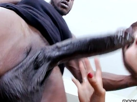 A stunning Asian woman enjoys a large black penis